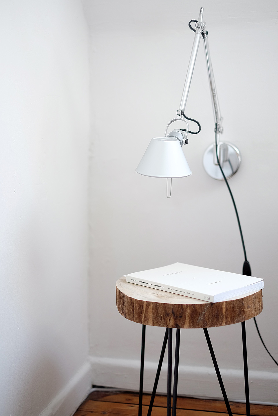 home-portfolio-01.jpg A stool with a book on top